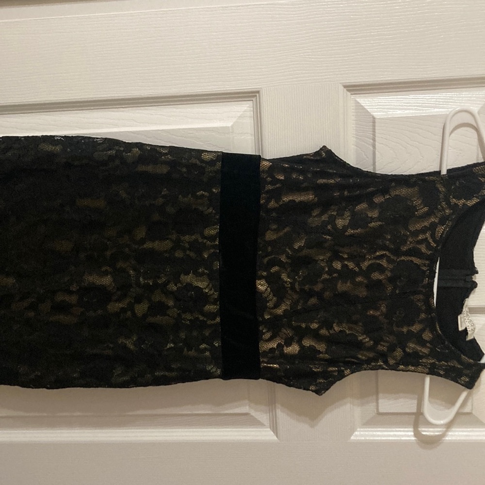 black lace dress with a gold sheer, with black velvet around the waist.